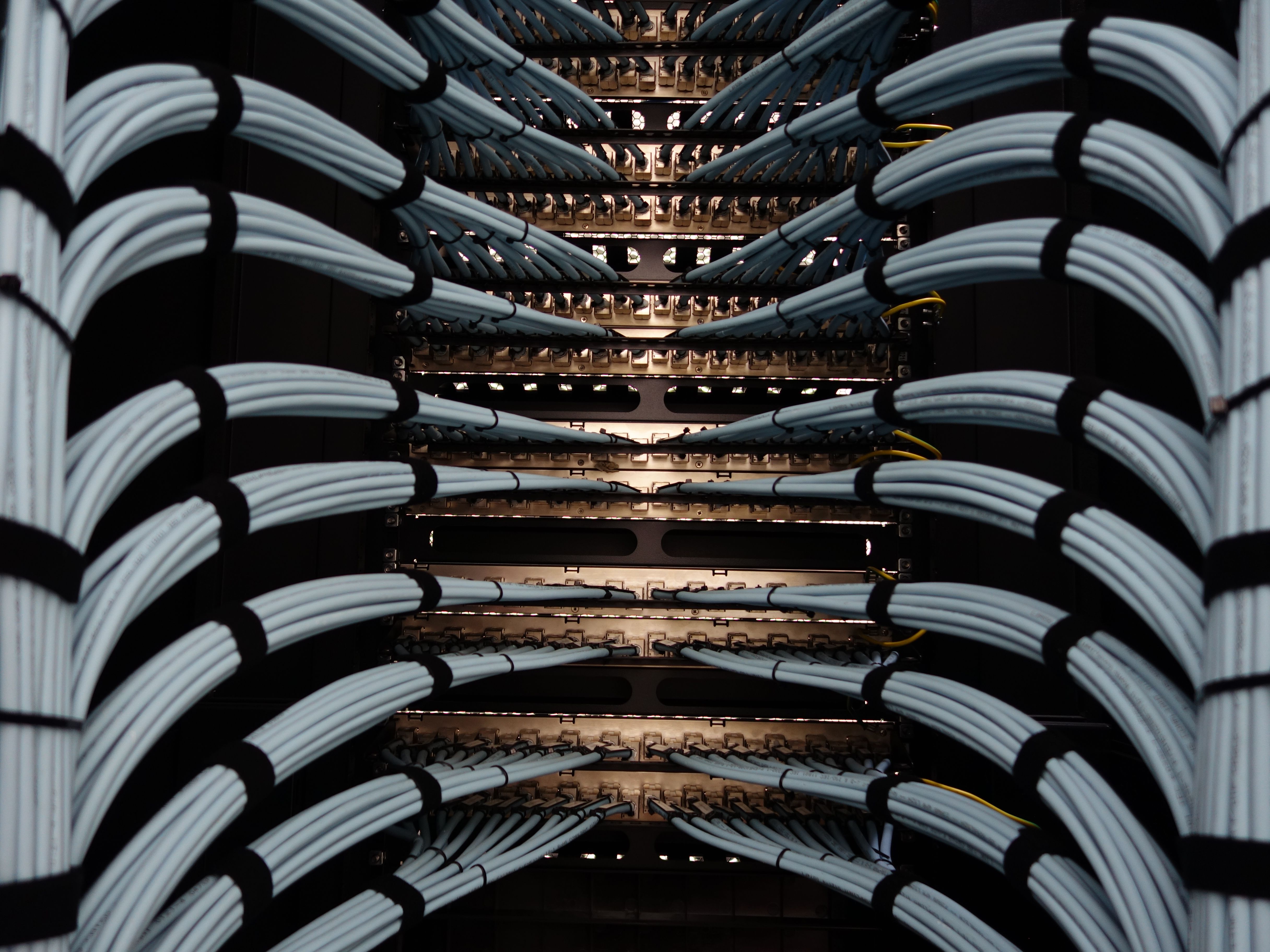 Dressed copper on a rack. Tidy bundles into the patch panel.